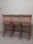 Three wooden counter-height stools with striped upholstered seats and backrests Style: Traditional Color: Beige...