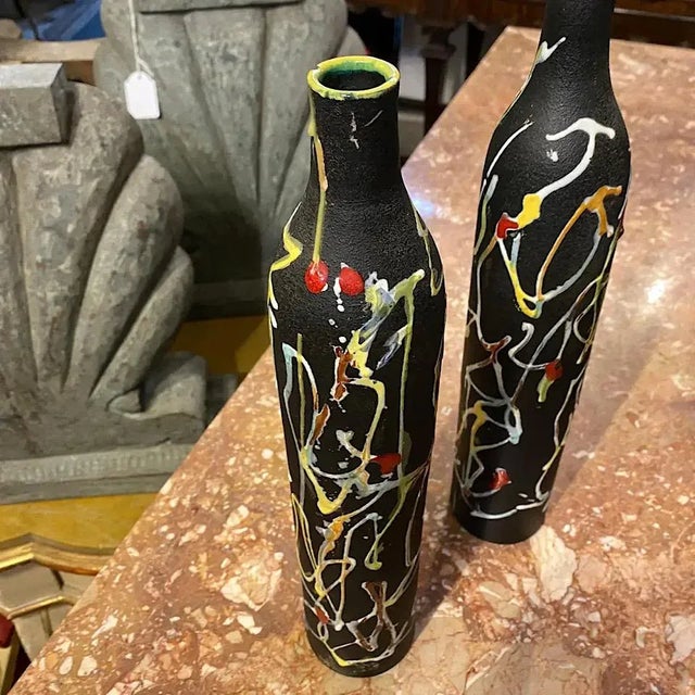 Two ceramic bottle vases made in Italy in the 1970s for Millefiori Cucchi, famous Italian liquor, by Ce.As Albisola. They...