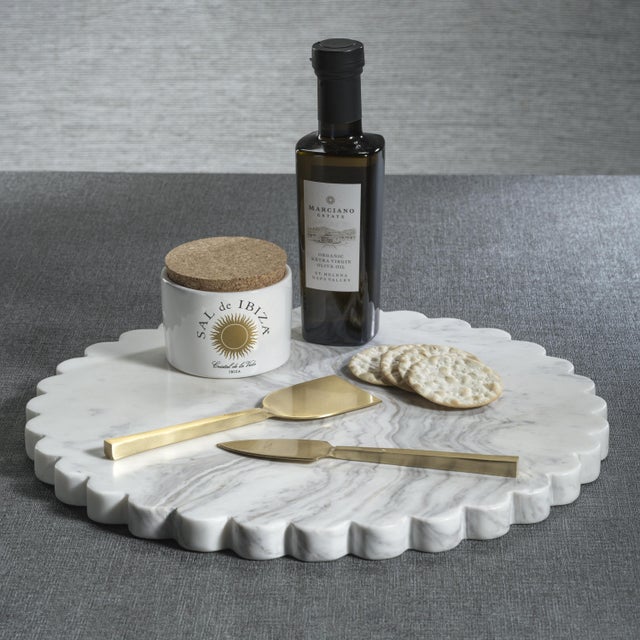 A stylish and functional piece, the Daisy Marble All-Purpose Board features a satin finish and delicately scalloped edges,...