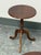 Design Plus Gallery presents a Round Tripod Pedestal Accent Table from The Bombay Company. The table has a circular wood...