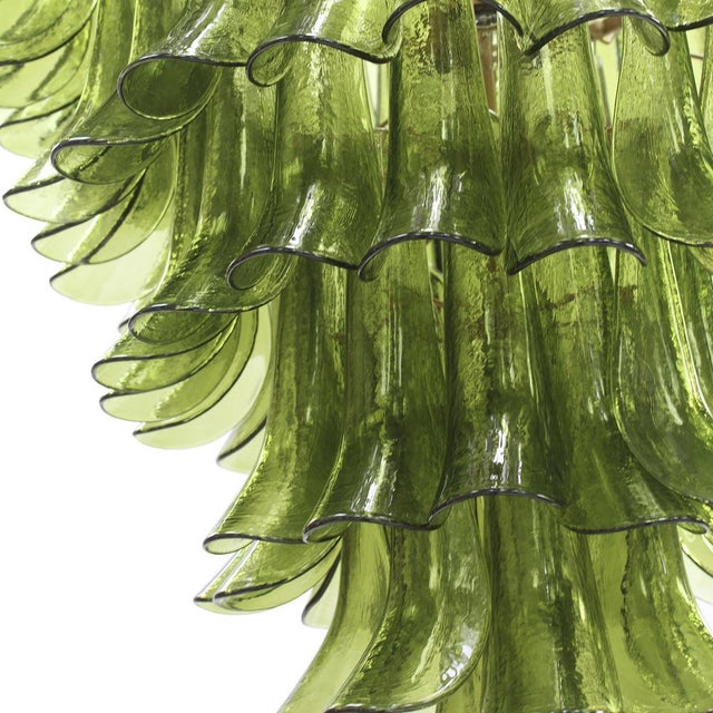 Suspension lamp composed of over 100 individually handcrafted petal-shaped elements in green Murano glass. The petals are...