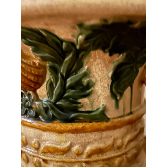 Vintage majolica urn/vase with handles. Beautiful ceramic green vine and gold shell relief motif. In great condition, no...