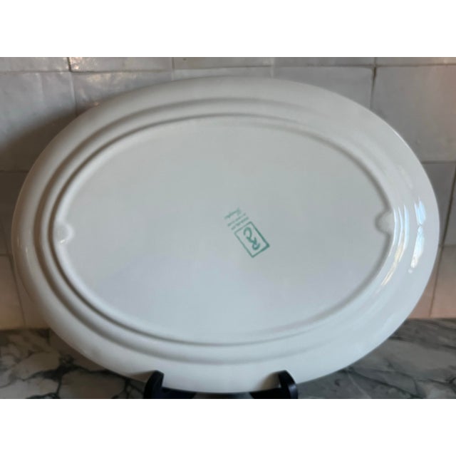 The Red Cliff Company, established in Chicago in 1950. The Grape Pattern features a raised grape and vine design in a...