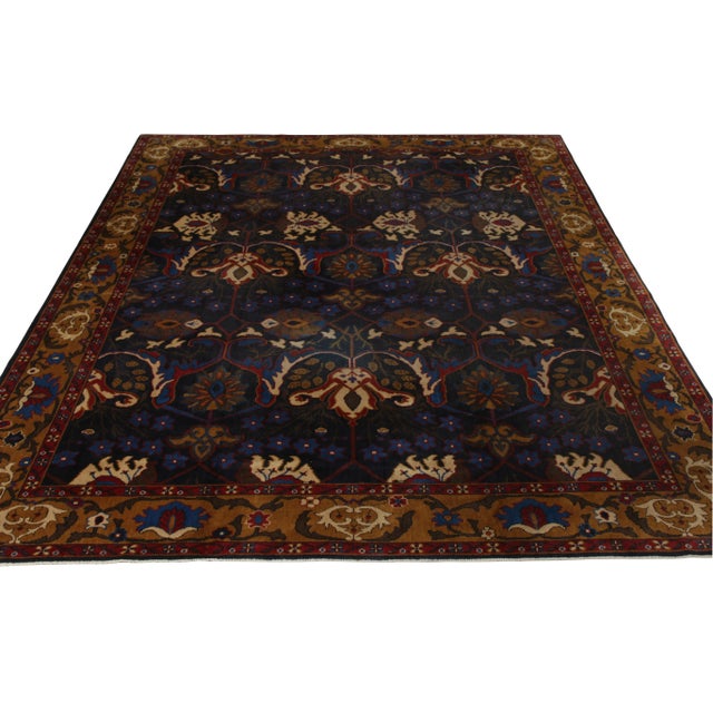 Originating from India in 1910, this hand-knotted antique Bidjar wool rug enjoys continental design influences and an...