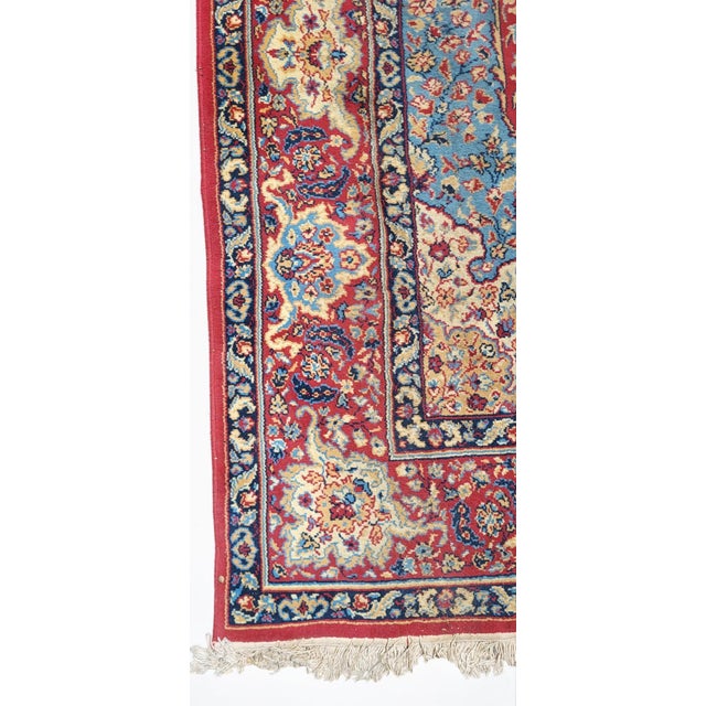 Persian Rug / 1970s / Wool The rug is organized around a large oval or rosette-shaped medallion, typical of Persian rugs....