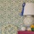 A sample of Club House Meadow Green Wallpaper Care Instructions: Wipe with damp cloth.