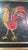 Original artwork depicting a stylized rooster in motion, created using a mixed media technique combining paint, colored...