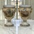 An exceptionally preserved pair of antique Belgian porcelain mantel urns by Pêtre à Baudour, distinguished by their...