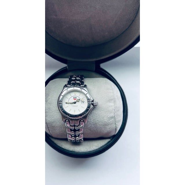 A vintage Tag Heuer Sports Elegance watch, white dial, stainless steel bracelet, Swiss-made, quartz, excellent condition —...