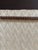 A 10-metre roll of thick, satin-finish fabric with a herringbone pattern in shades of beige Composition: 85% viscose – 15%...