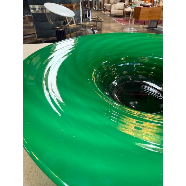 Elegant hand-blown Murano glass centerpiece in a rich emerald tone, formed with a wide, gently flared rim and a deep,...
