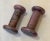 A petite pair of pinkish-gray granite candlestick holders. These are cute and in decent shape. A few scratches but nothing...