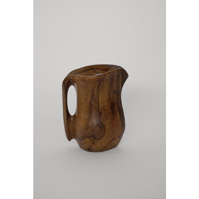 Vintage Handcrafted Wooden Pitchers, Set of 2, in Very Good conditions. Designed 1970 to 1979 This piece has an...