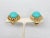 This is part of Chairish’s Costume Jewelry assortment. 1960s round goldtone cabochon faux-turquoise center with wavy...