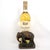 A heavy and deeply case antique cast iron bookend of a walking elephant. It has been given a rich copper patina. The...