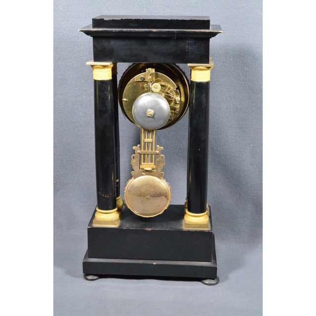 Elegant French Napoleon III portico mantel clock dating from the mid-19th century, circa 1855–1870, combining an...