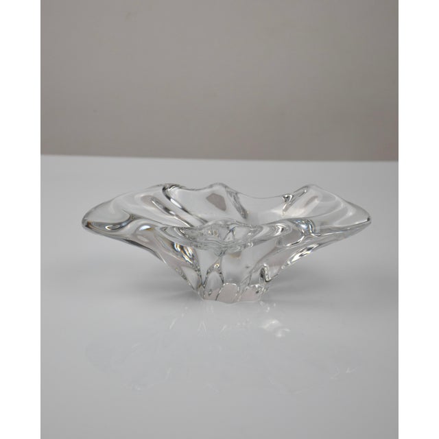 Elegant clear crystal piece by Baccarat, featuring a freeform, undulating silhouette characteristic of mid-20th-century...