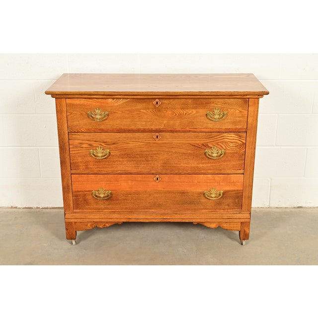 A gorgeous antique Victorian dresser or chest of drawers In the era of Herter Brothers USA, Circa 1890s Carved oak, with...