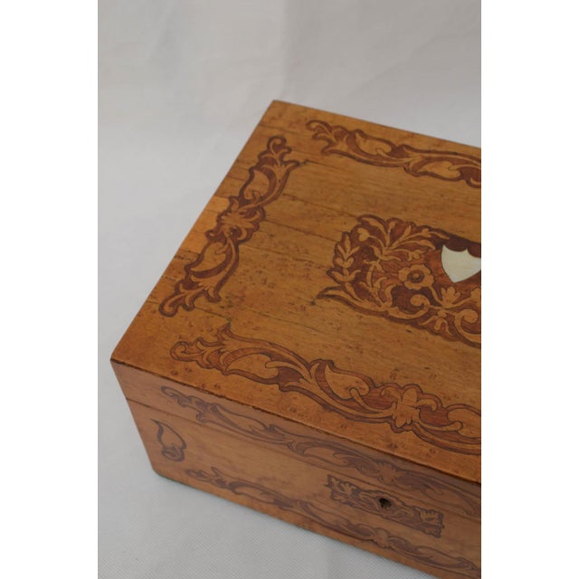 A superb victorian bird's-eye maple and tulipwood jewellery or sewing box, dating to circa 1860. This exquisite piece...