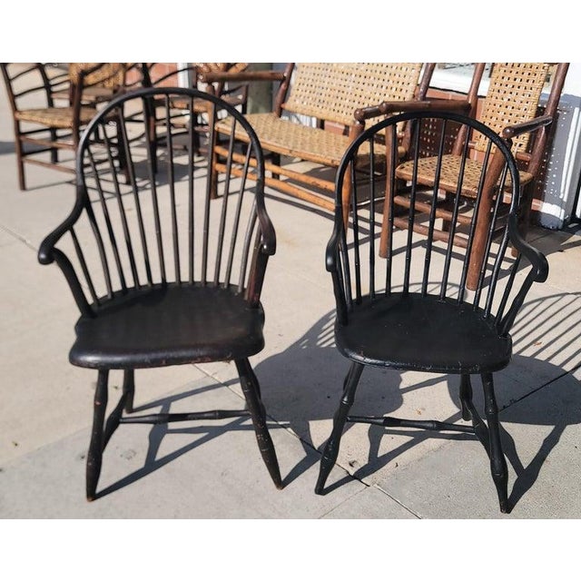 19Thc Collection of three 19thc Philadelphia,Pa. Saddle seat Windsor arm chairs.Two are painted a very dark brown paint &...