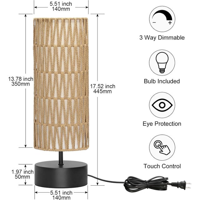 A modern rattan table lamp that blends natural texture with contemporary design. The dual‑layer woven shade diffuses warm...