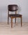 Set of eight chairs with wooden frame and gold-plated brass feet, upholstered in brown faux leather, designed by Anonima...