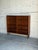 This elegant Scandinavian shelving unit features clean minimalist lines, adjustable shelves, and warm richly grained teak...