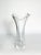Crystal vase, France, 1970s, remarkable for its slender, organic shape with fluid lines. Its wide, almost corolla-like...