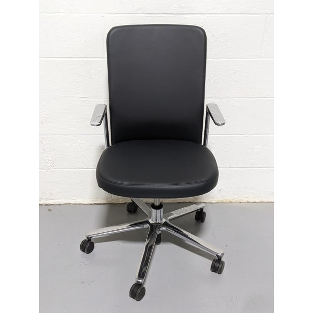 Pacific Chair manufactured by Vitra. Simple and sophisticated design, the long backrest hides all the mechanisms of the...