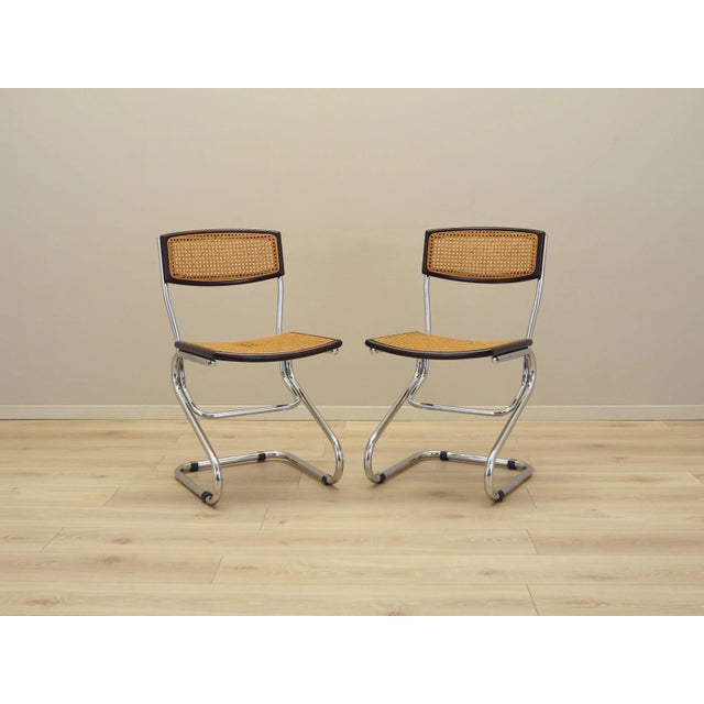 The set of two chairs was made in the 1960s, Italian production. Bauhaus style chairs. The frame is made of metal. The...