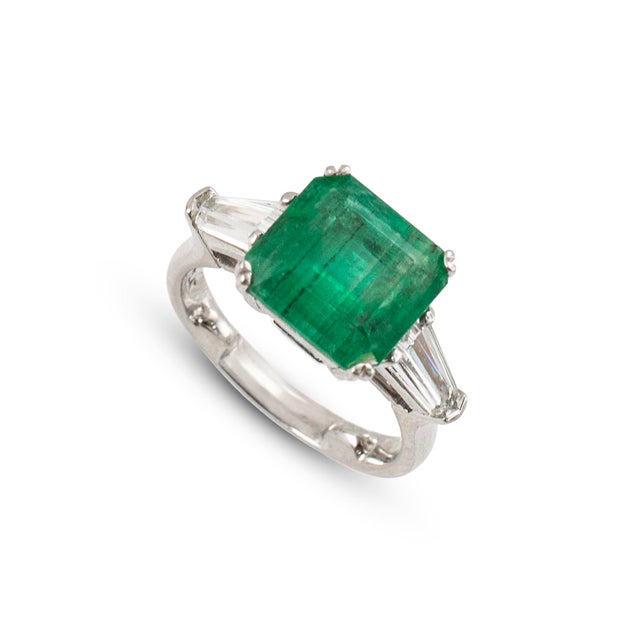Gender: Ladies Metal Type: 900 Platinum Ring Size: 4.25 Width: 2.60 mm Weight: 6.79 grams Ladies 900 platinum three-stone...