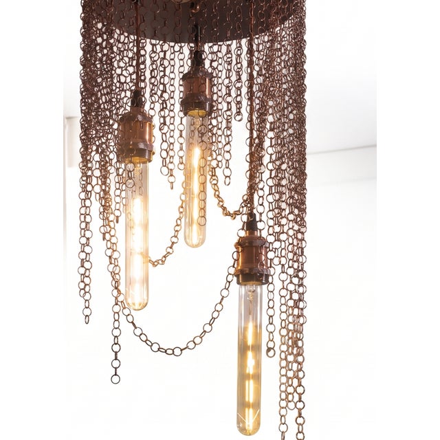 The concept: western nostalgia and cinema noir slavery is a pendant chandelier that transports the viewer into the...