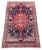 A beautiful antique Malayer rug, woven circa 1900. The design features a large tomato red medallion on an indigo field and...
