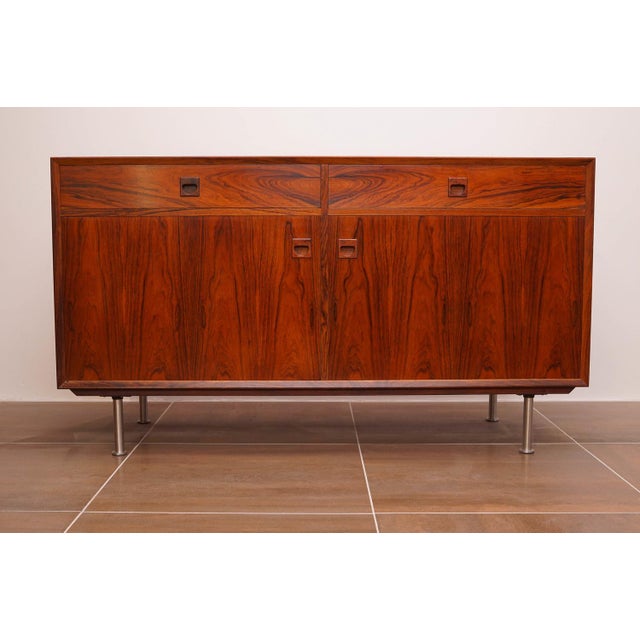 Mid-century modern Scandinavian sideboard from Brouer Möbelfabrik. Nicely crafted with wooden hand grips. This piece is...