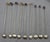 Collection of 9 Brazilian silver & quartz crystal iced tea spoons or muddlers. Sterling twisted wire shafts, each with a...