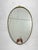 Oval brass wall mirror, Made in Italy, 1950s Mirror intact, small signs of aging on the brass that make the mirror even...