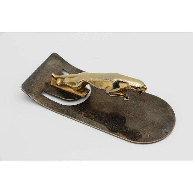 Circa: 1970. Country: England. Material: Metal. Item condition: Some faded surfaces. Minor cracks on the Jaguar tail. Some...