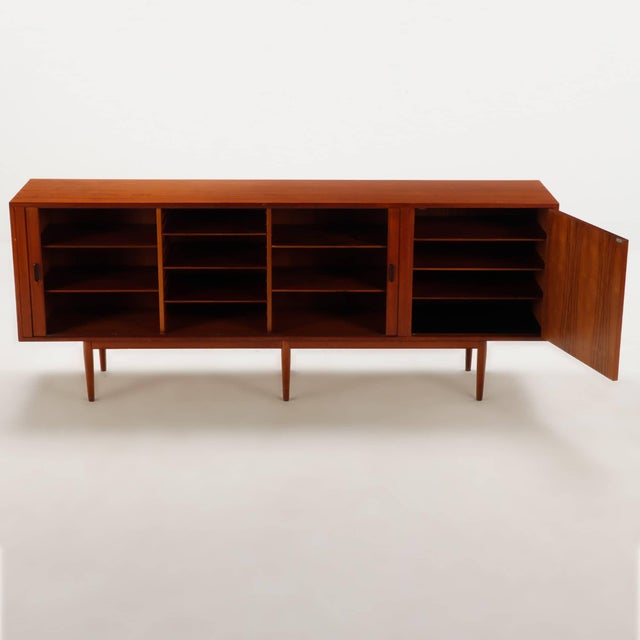 A striking example of Danish Mid-Century Modern design, this Model 37 credenza was designed by Arne Vodder for Sibast...