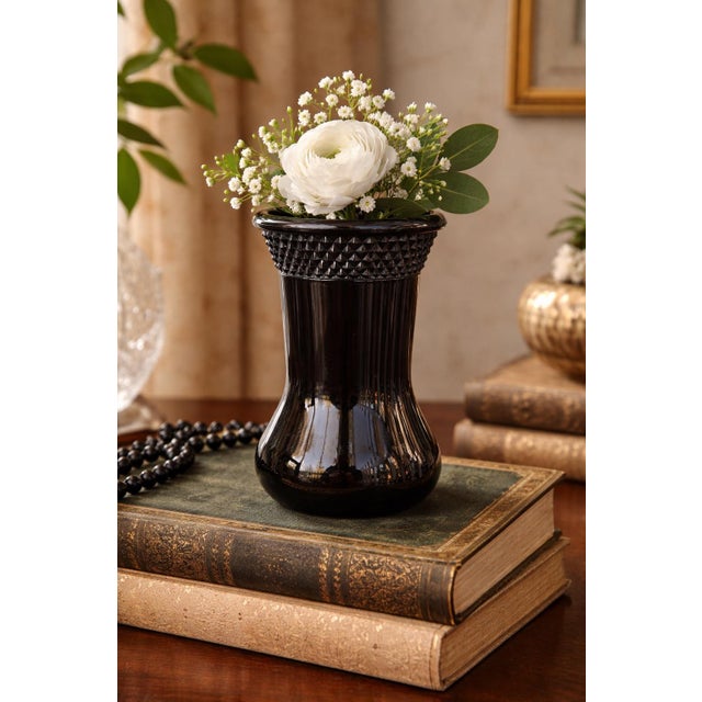 This vintage black amethyst Depression glass vase cup was produced by the Tiara Glass Company circa the 1930s. Rendered in...