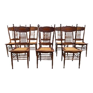 Early 20th Century Set of 8 Antique Oak Press Back Cane Seat Dining Chairs For Sale
