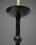 A pair of bronzed metal candlestick-form table lamps in the antique taste, each with a tall columnar shaft, dished...