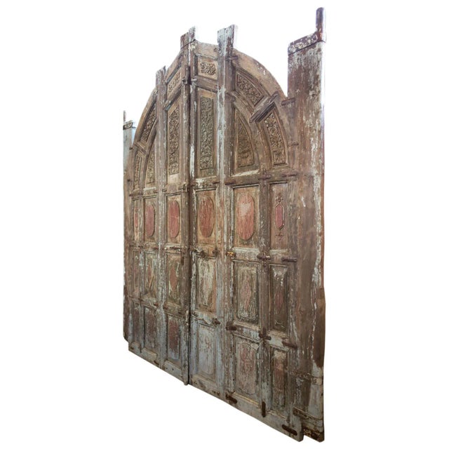 Exquisite pair of antique large teak carved entrance doors from north India. Heavy duty palace gates with pink and green...