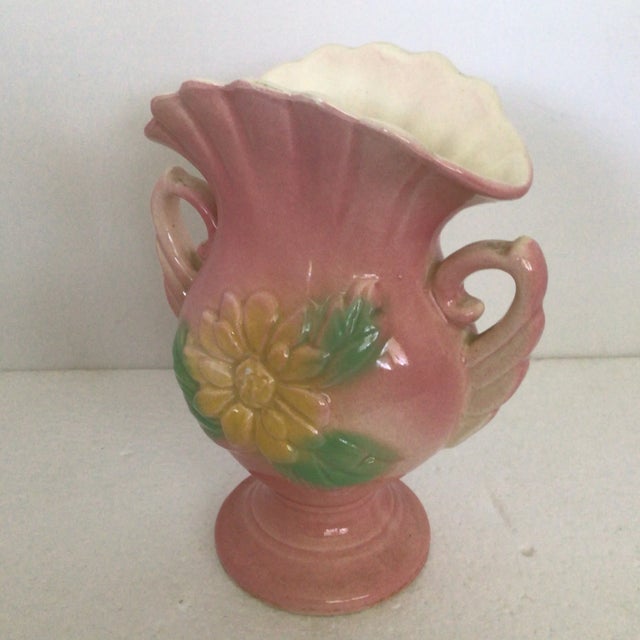 This pink vase with yellow magnolia flowers and green blue leaves is a Hull classic with soft lines and magnolia flowers...