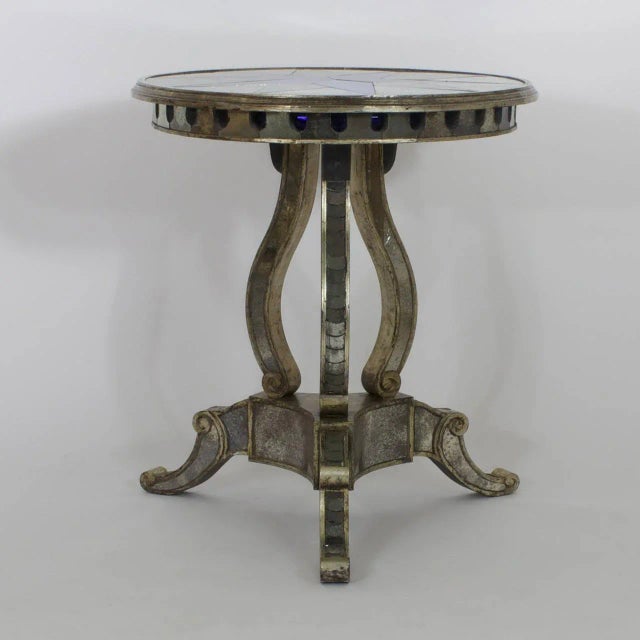 Stunning pair of mirrored end tables that are an intriguing combination of influences. Manufactured in the Mid-Century and...