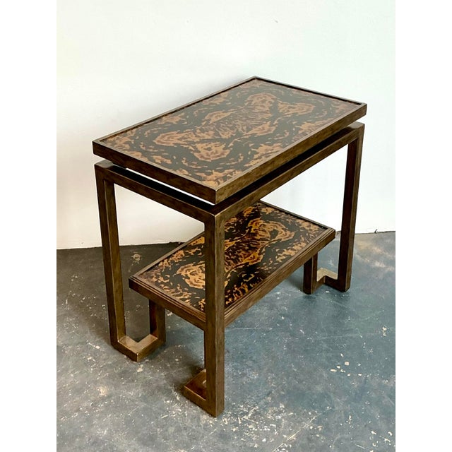 Elevate your entryway or living space with this striking vintage bi-level console table, a masterclass in Hollywood...