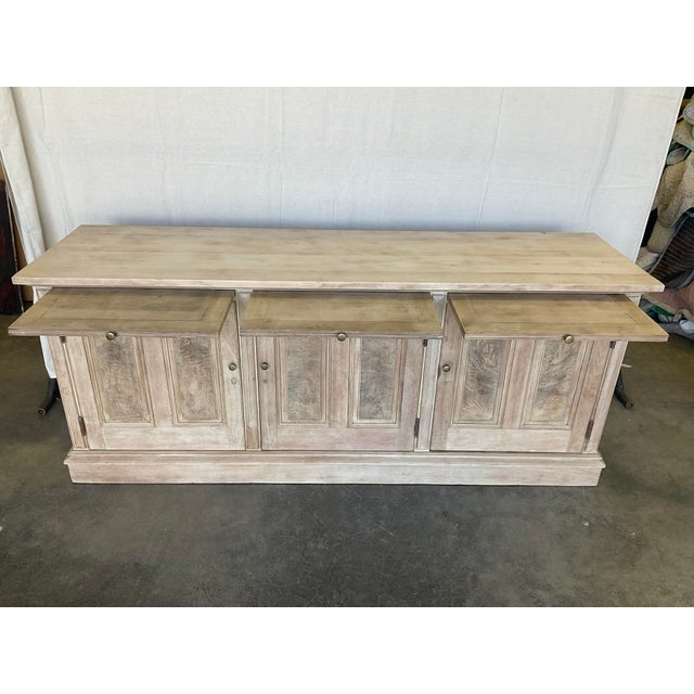 19thC Bleached Walnut Store Display Counter Cabinet with Raised Panels in good estate condition. It features pull out...