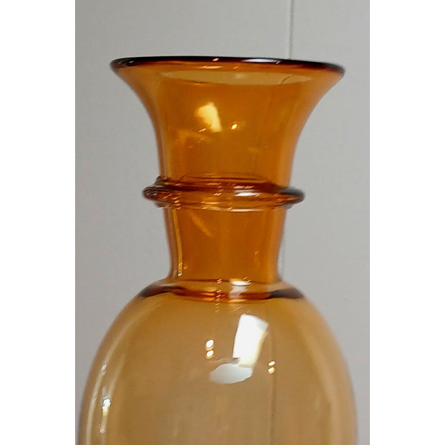 This lovely vase is 26 inches high and 6 inches at widest point. It's unique style, makes it standout addition to any...