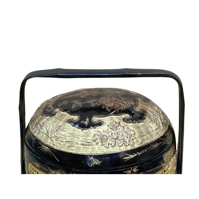 This is an exquisite, multi-tiered Chinese wedding basket or picnic/food carrier crafted from lacquerware, often...