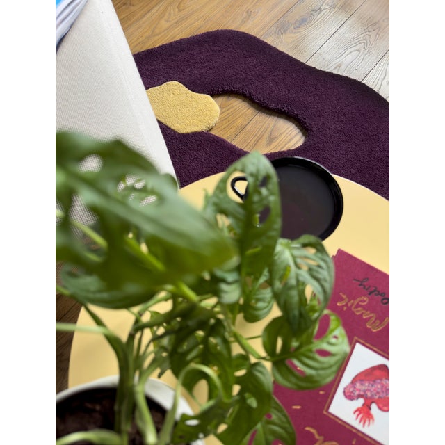 Abstract shaped wool rug by London-based artist Alan Thomas. This piece is made from 100% New Zealand wool in berry and...