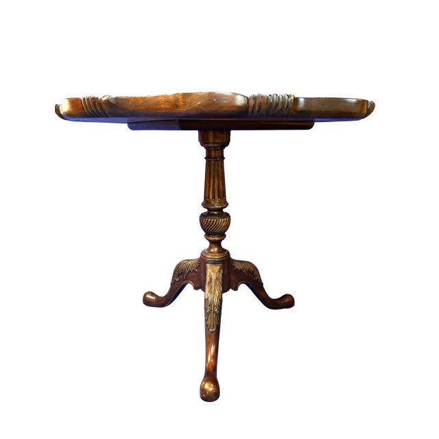 This is a stunning and substantial Georgian-style center table by the renowned makers at Maitland-Smith. Crafted with the...